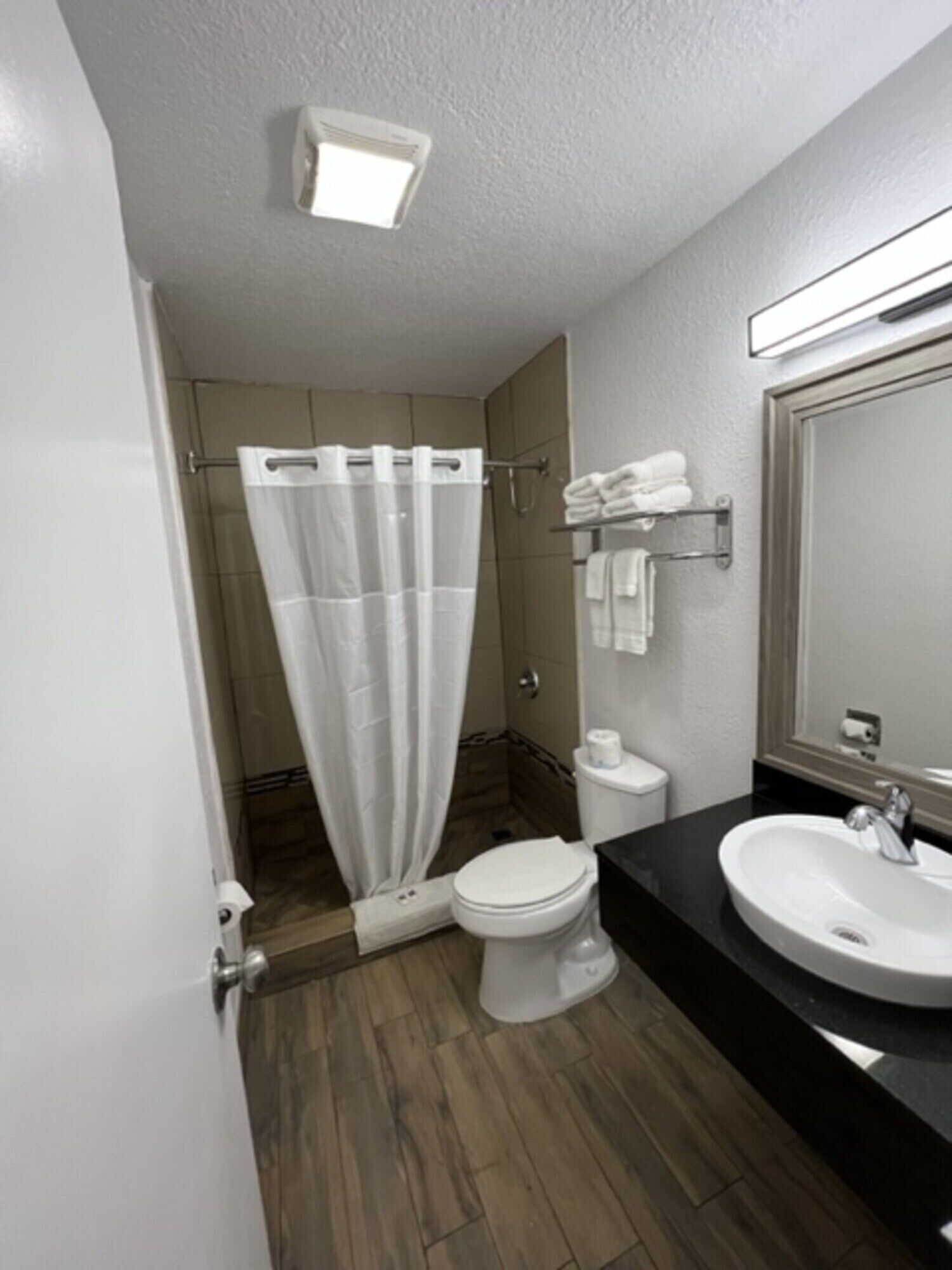 Bathtub, hair dryer, towels