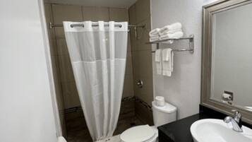 Bathtub, hair dryer, towels