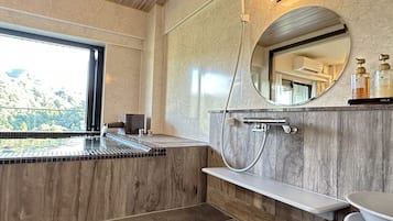 Separate bathtub and shower, free toiletries, hair dryer, slippers