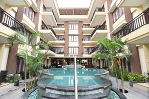 4 outdoor pools, pool umbrellas - Kuta Townhouse Apartments (Kuta)