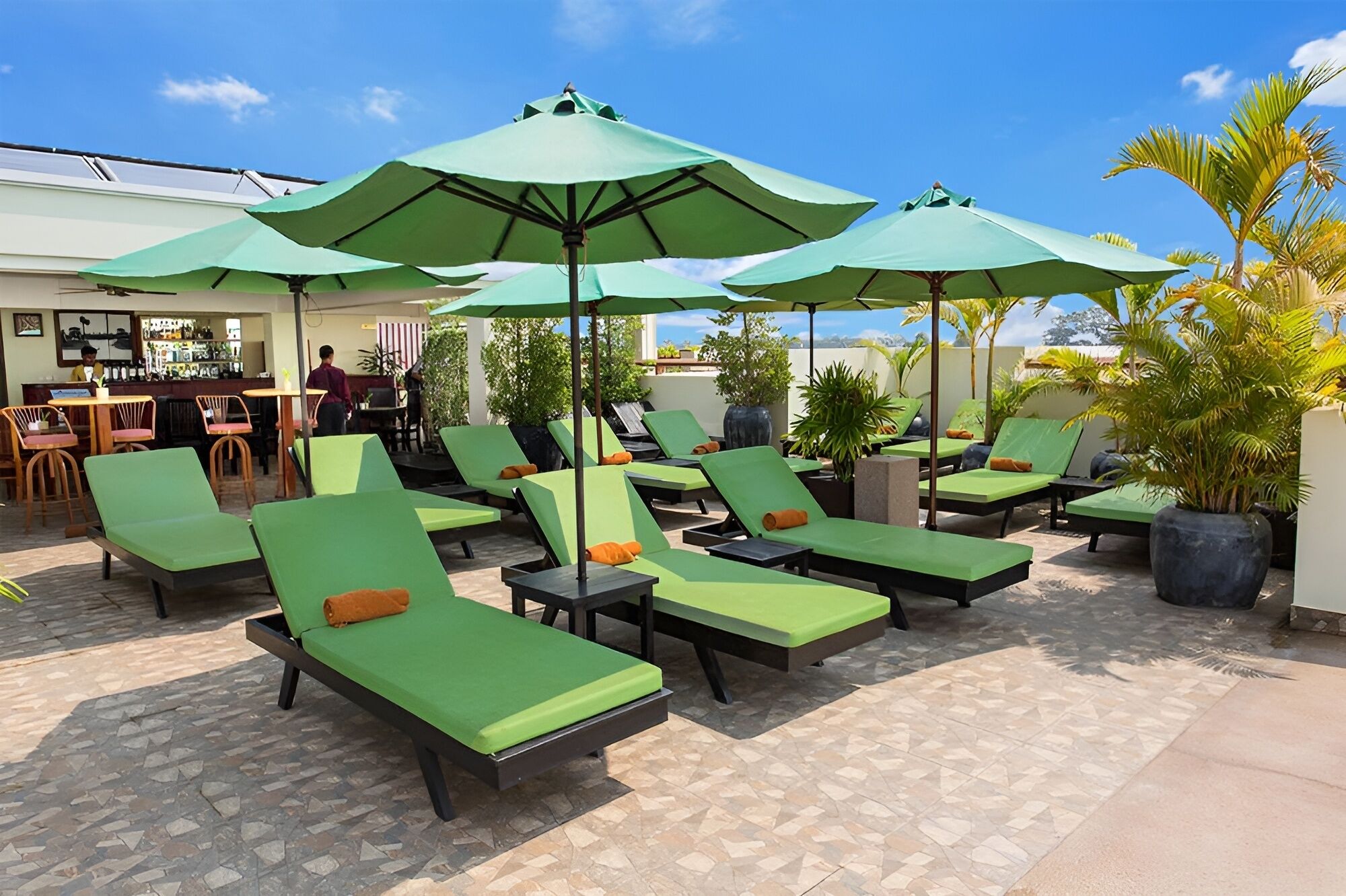 Outdoor pool, open 10:00 AM to 9 PM, pool umbrellas, pool loungers