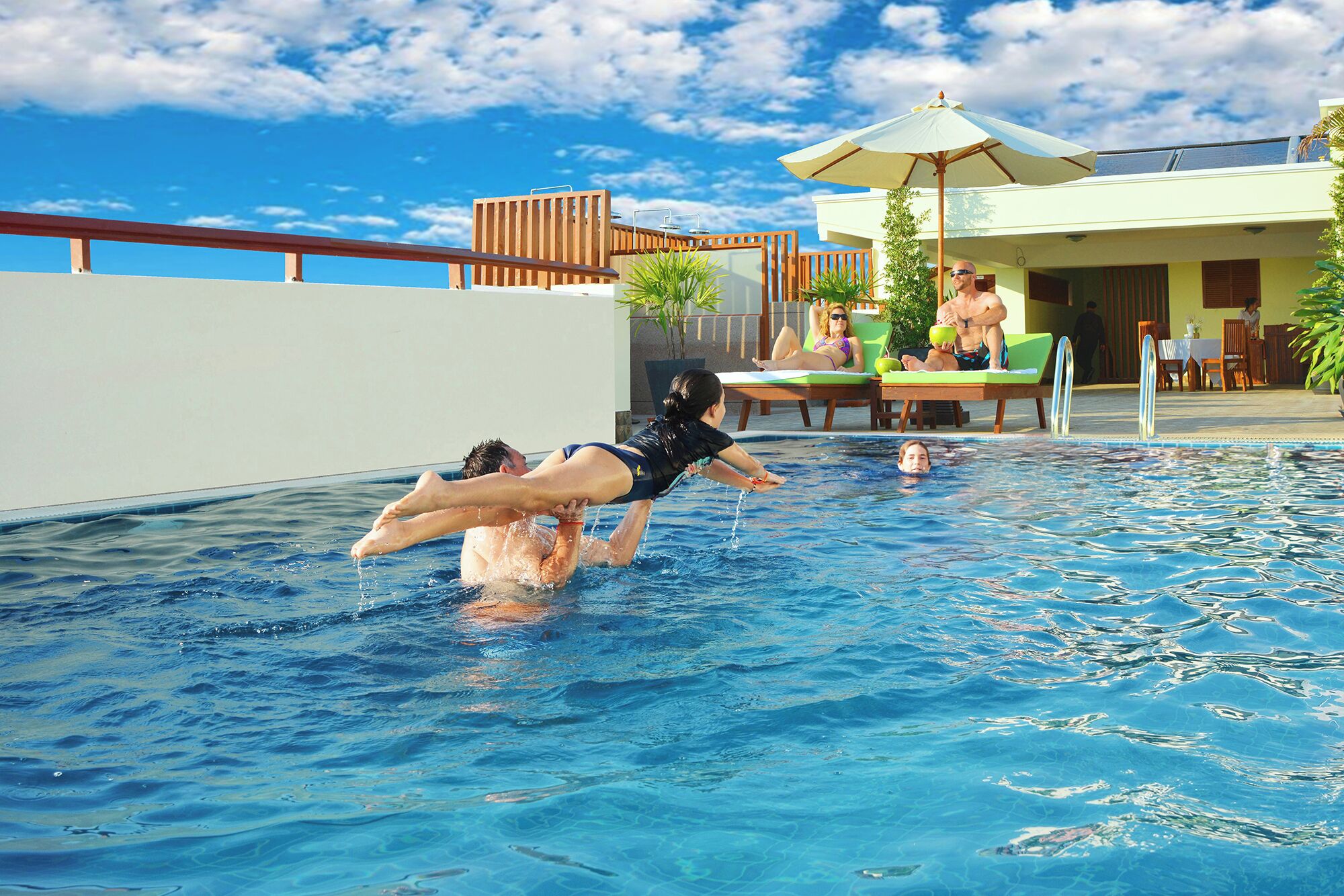 outdoor pool, open 10:00 am to 9 pm, pool umbrellas, pool loungers