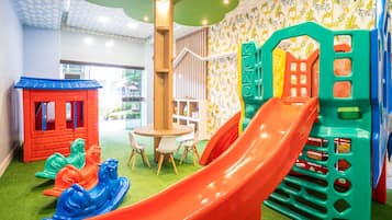 Kids can play and explore on the slide, climbing frames, and rocking horses in this fun play area.