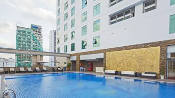 Outdoor pool, pool umbrellas, sun loungers