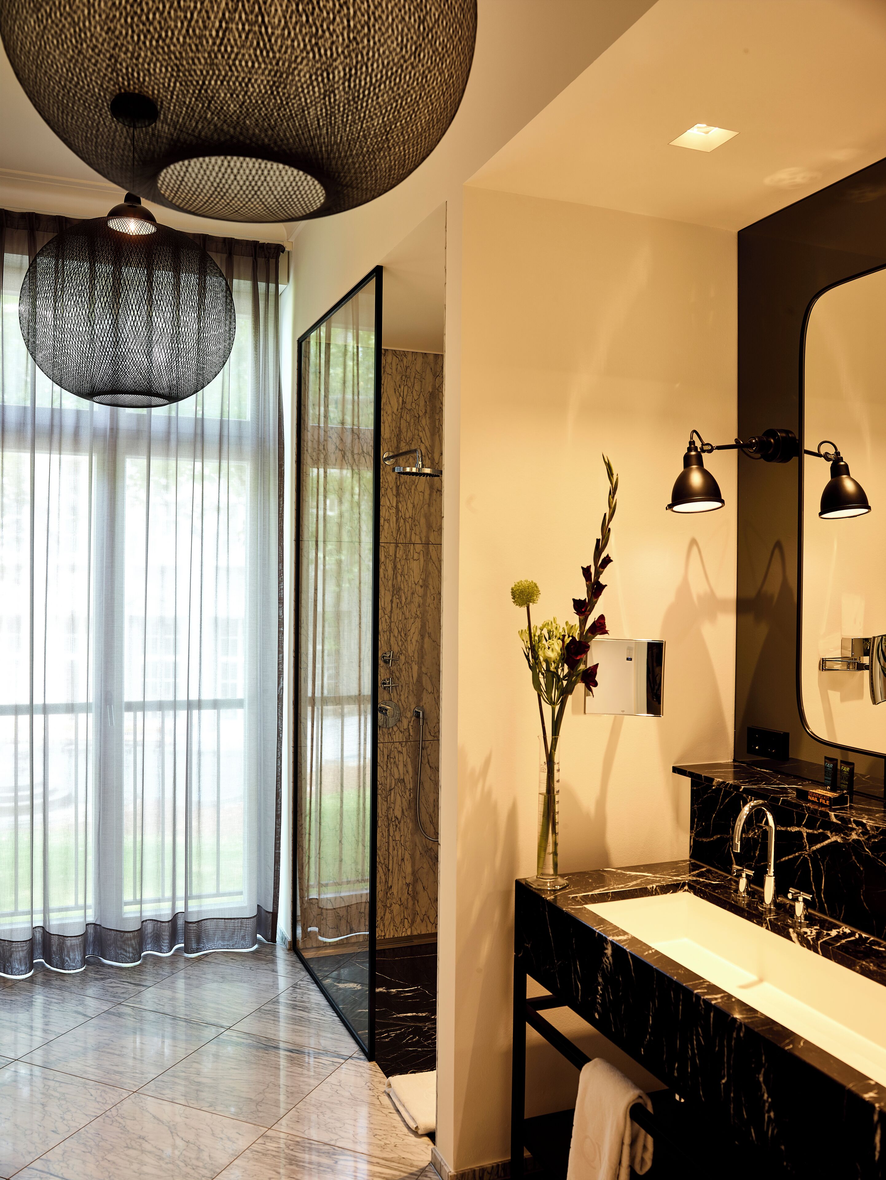 rainfall showerhead, eco-friendly toiletries, hair dryer, slippers