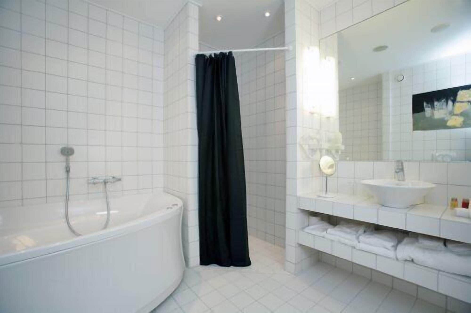 suite, bathtub | bathroom | hair dryer, towels