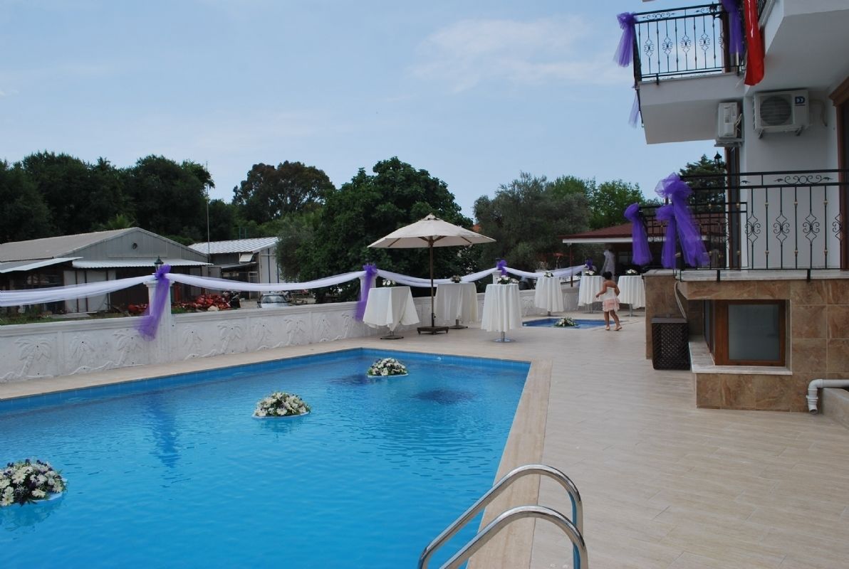 seasonal outdoor pool, pool umbrellas, pool loungers