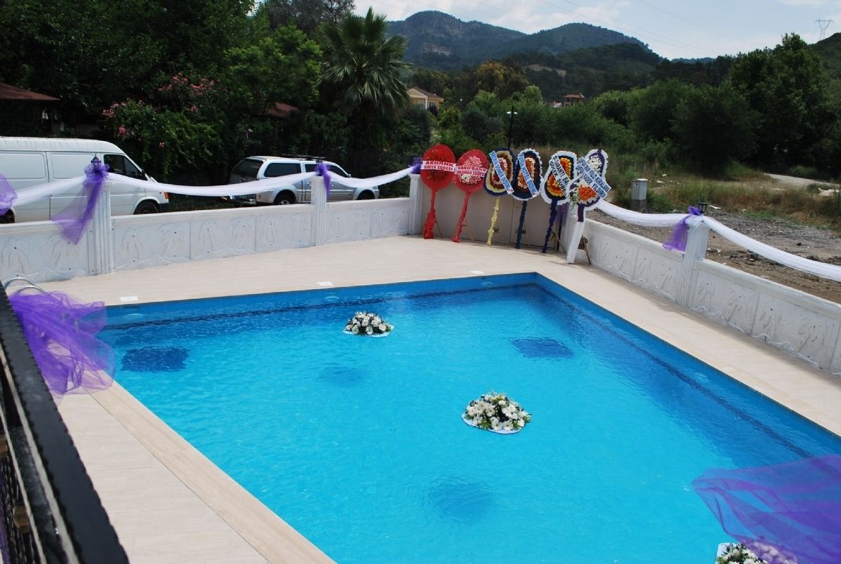 seasonal outdoor pool, pool umbrellas, pool loungers