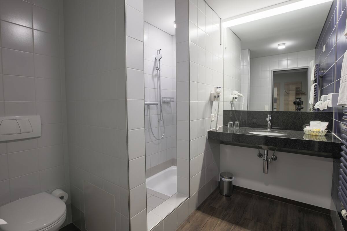 superior room | bathroom | shower, free toiletries, hair dryer, bathrobes