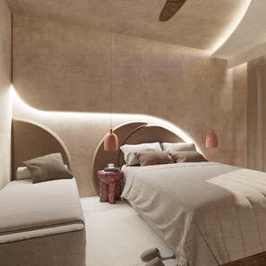 Um quarto moderno com uma cabeceira curva, uma mesa de cabeceira e uma luminária pendente.