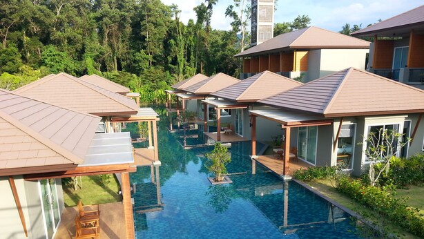 A resort with multiple overwater bungalows connected by a clear pool. - Khaolak Forest Resort (Takua Pa)