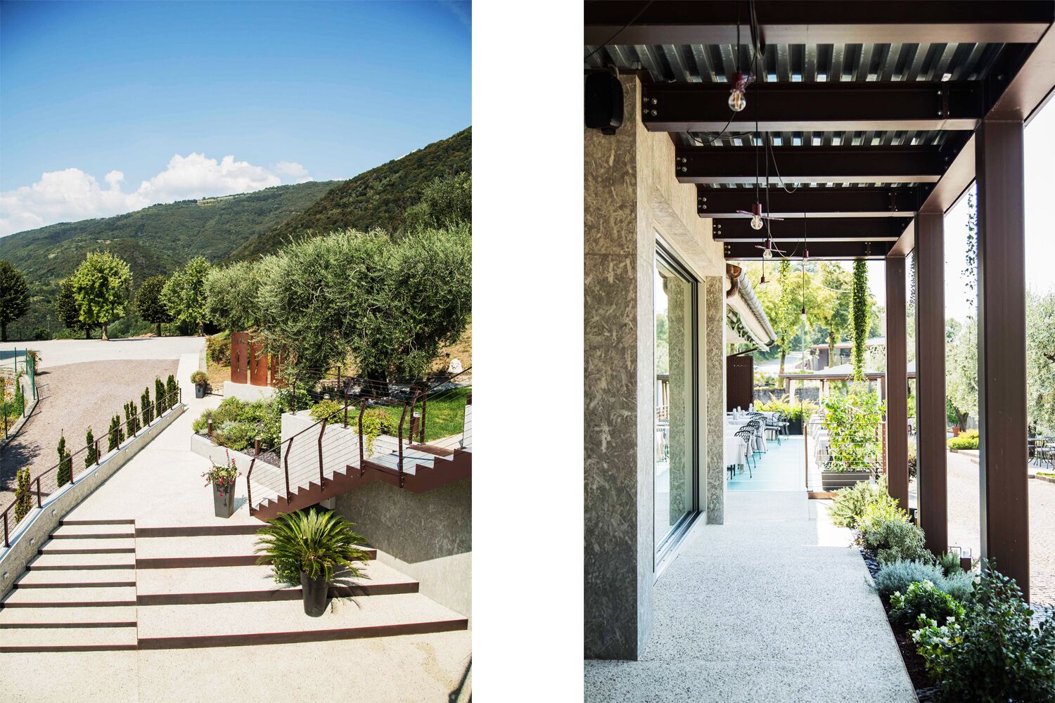 A hotel exterior with a paved outdoor area, steps leading to a covered patio, and a view of a mountainous landscape.