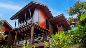 A two-story building with a balcony and a pool. - Alama Sea Village Resort (Ko Lanta)