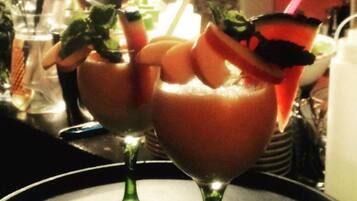Two cocktails in stemmed glasses on a tray.
