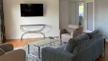 Two Bedroom Grande Suite | Living area | 40-inch flat-screen TV with cable channels, TV