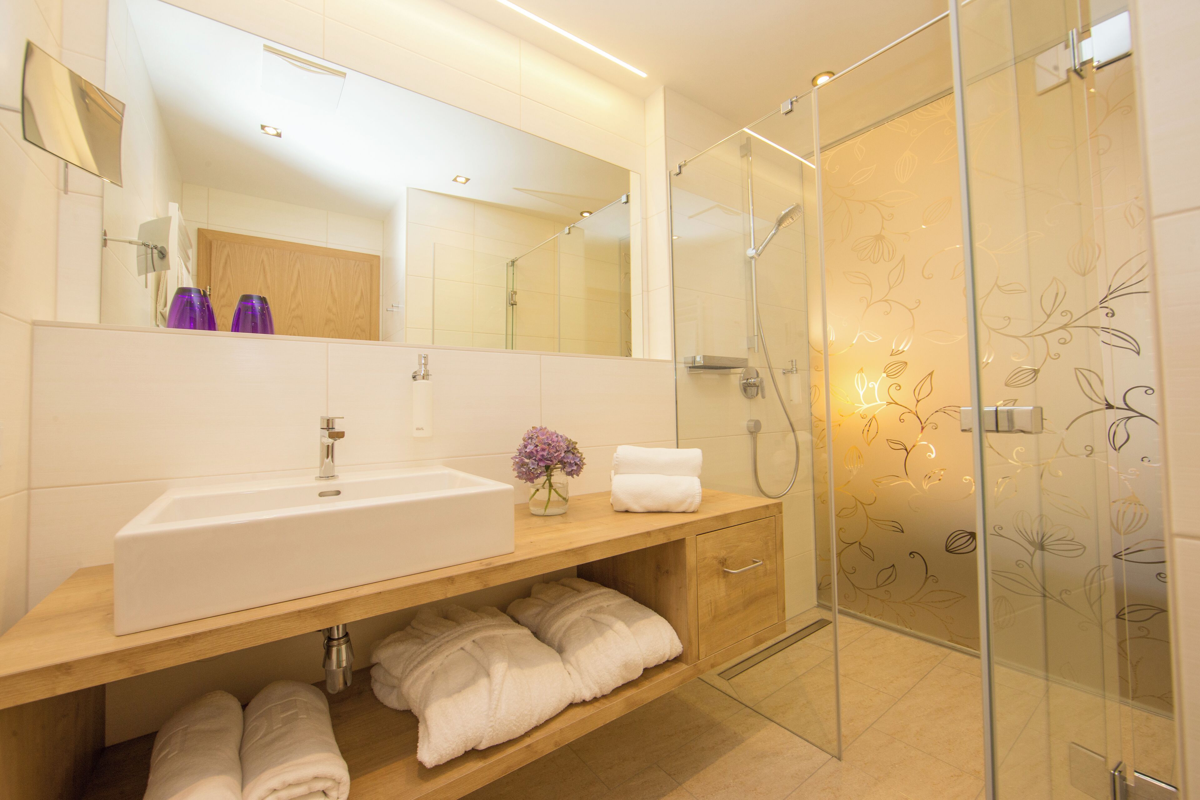 spring water bathtub, hydromassage showerhead, hair dryer, bathrobes