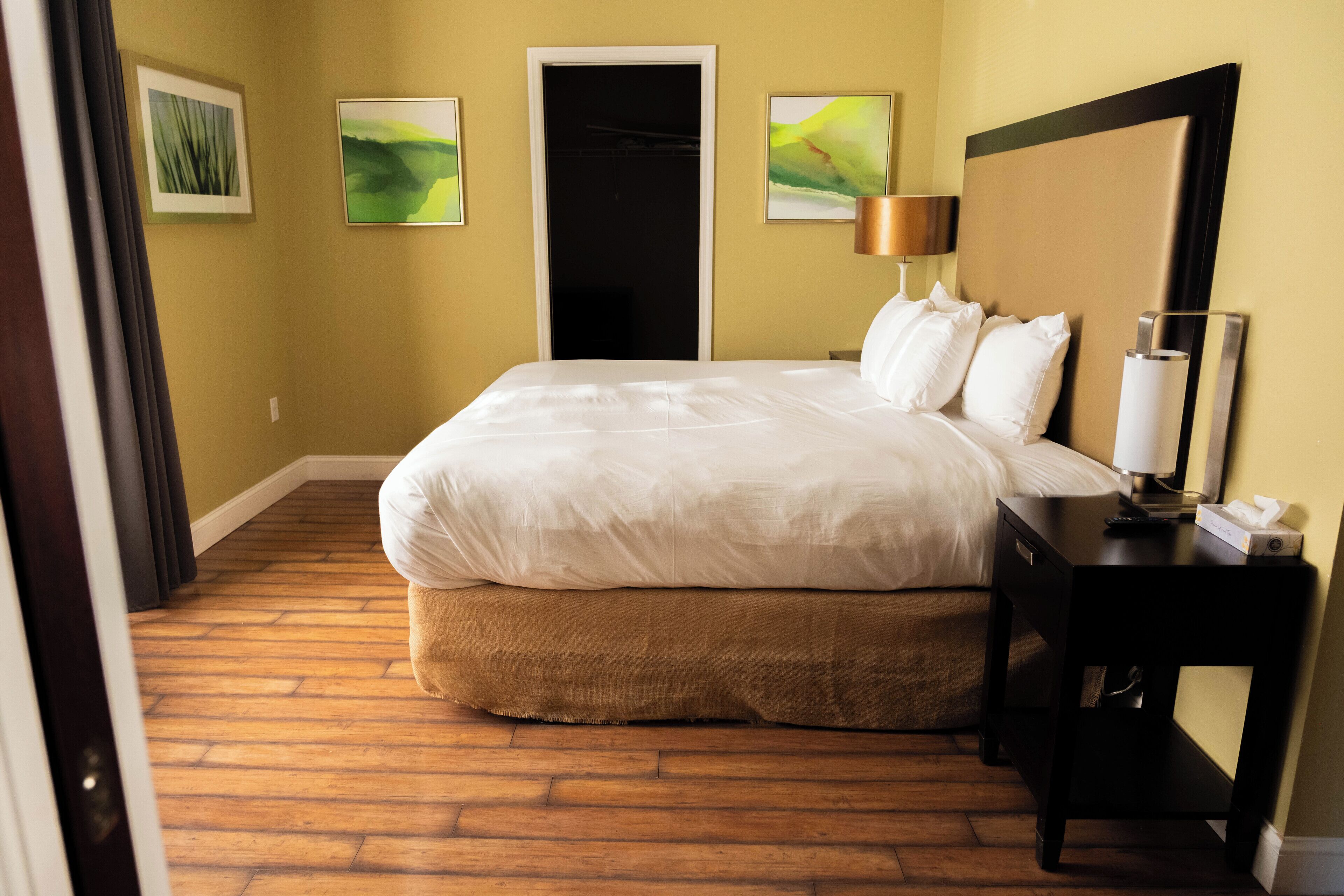 Premium bedding, desk, laptop workspace, iron/ironing board