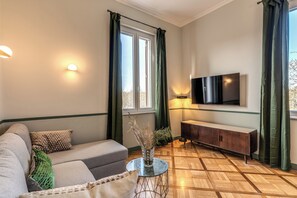 Apartment, Terrace, River View | Living area | 50-inch flat-screen TV with digital channels, TV - Tree Charme Trilussa (Rome)