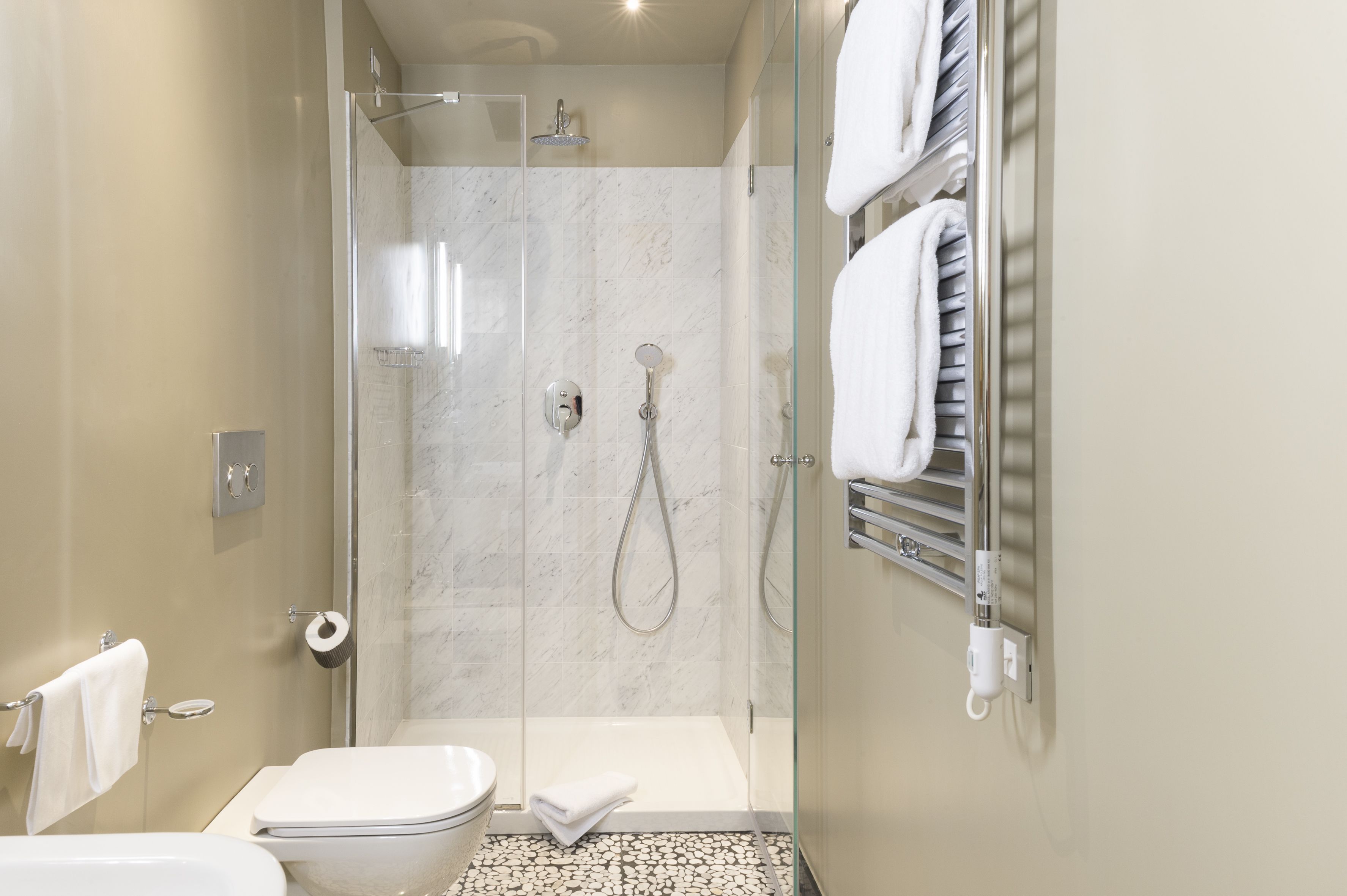 designer toiletries, hair dryer, bathrobes, slippers