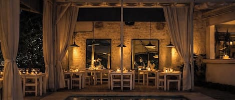 Breakfast, lunch, dinner served; international cuisine, pool views