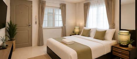 A hotel room with a bed, bedside lamps, a TV, a door, and a window with curtains.