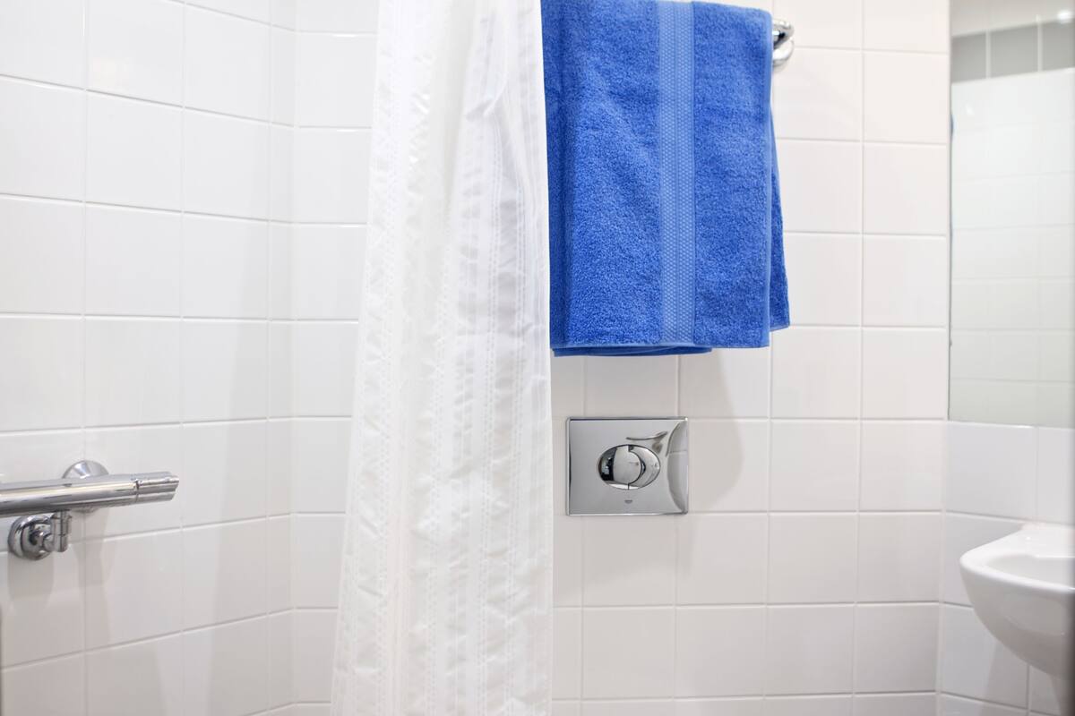 superior double room | bathroom | shower, free toiletries, hair dryer, towels