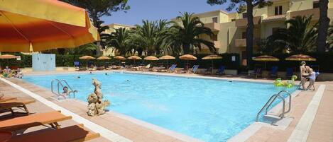 Seasonal outdoor pool, open 10:00 AM to 6:00 PM, pool umbrellas