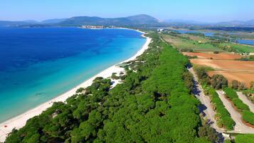 Beach nearby, white sand, sun loungers, beach umbrellas