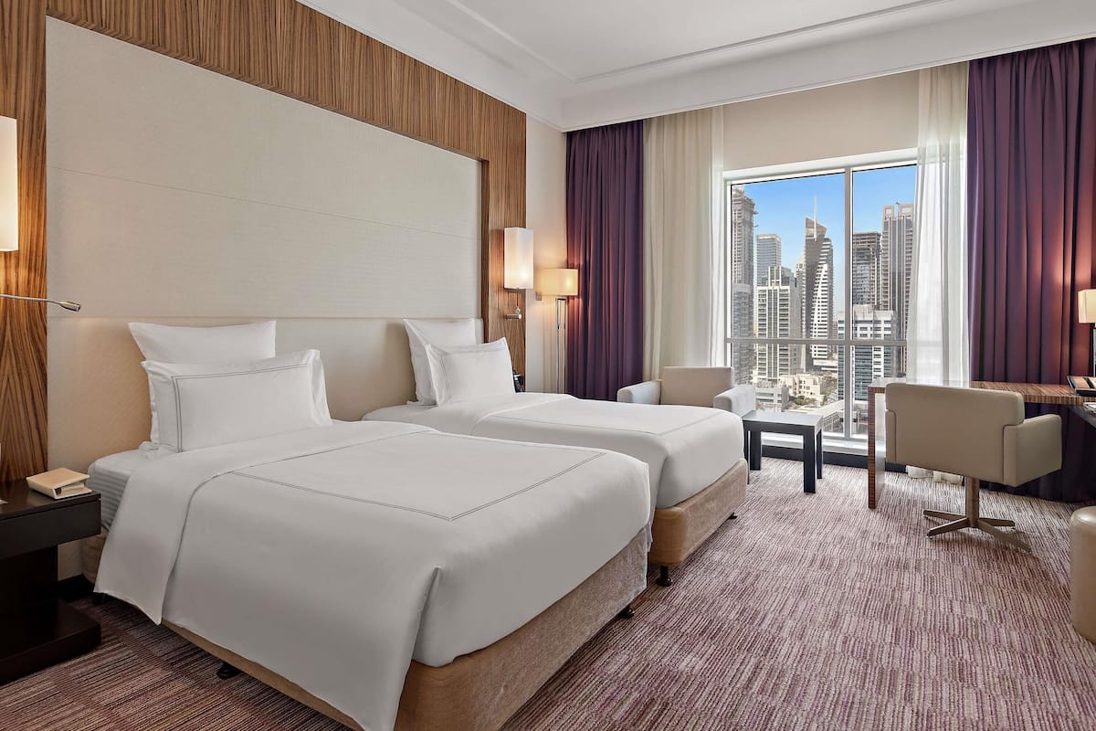 Premium bedding, pillow-top beds, minibar, in-room safe