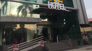 A modern hotel with a glass facade and a prominent sign reading "M2 HOTEL". - M2 Hotel Melaka (Malacca City)