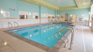 An indoor swimming pool with clear water, tiled walls, and a no diving sign. - Holiday Inn Bismarck by IHG (Bismarck)
