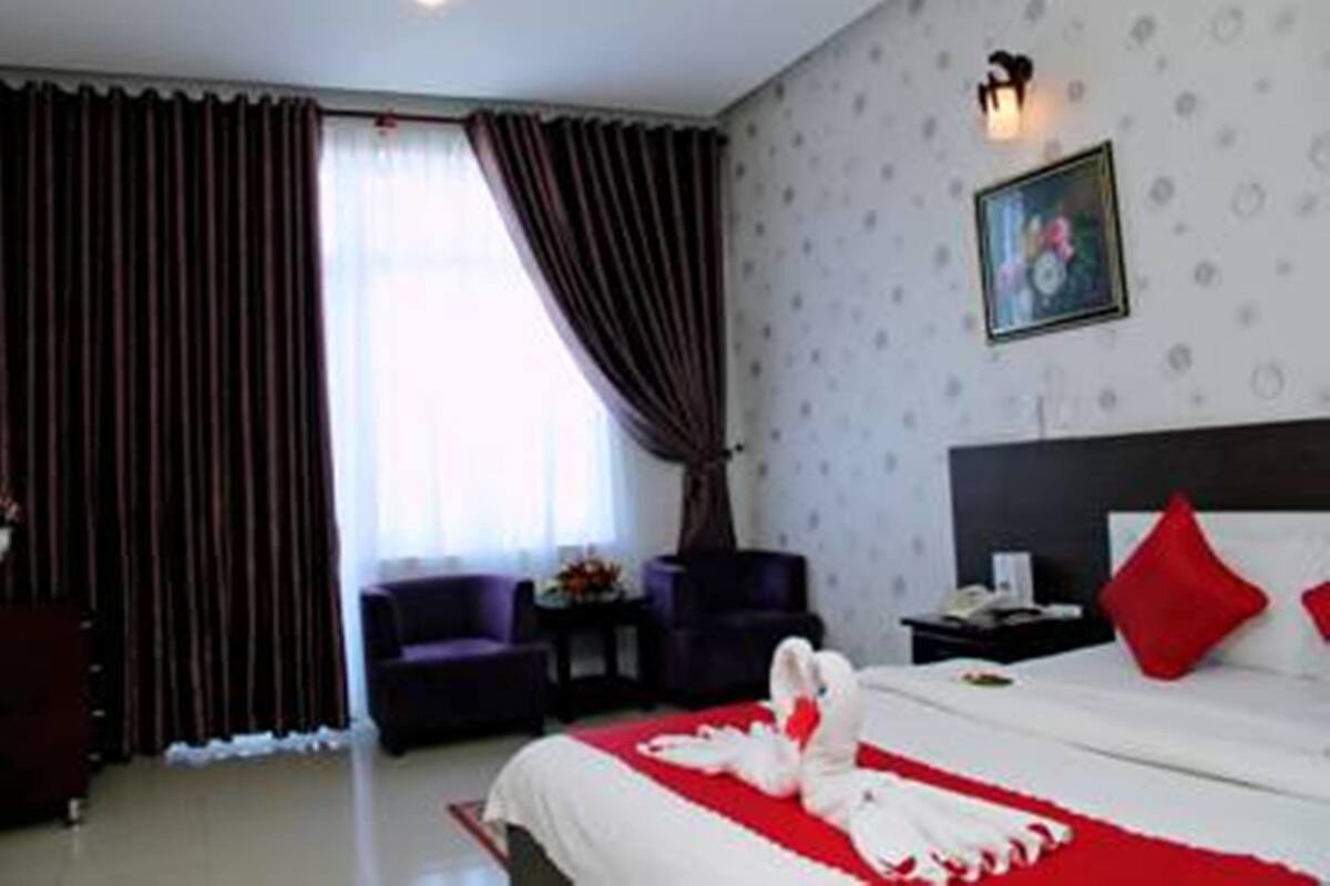 Standard Double Room, Partial Sea View | Minibar, in-room safe, desk, free WiFi