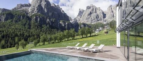 Indoor pool, outdoor pool, open 7:00 AM to 7:00 PM, pool umbrellas