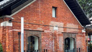 A red brick building with a sloped roof, large windows, and a visible chimney. - Art'otel Ximending Taipei (Taipei)