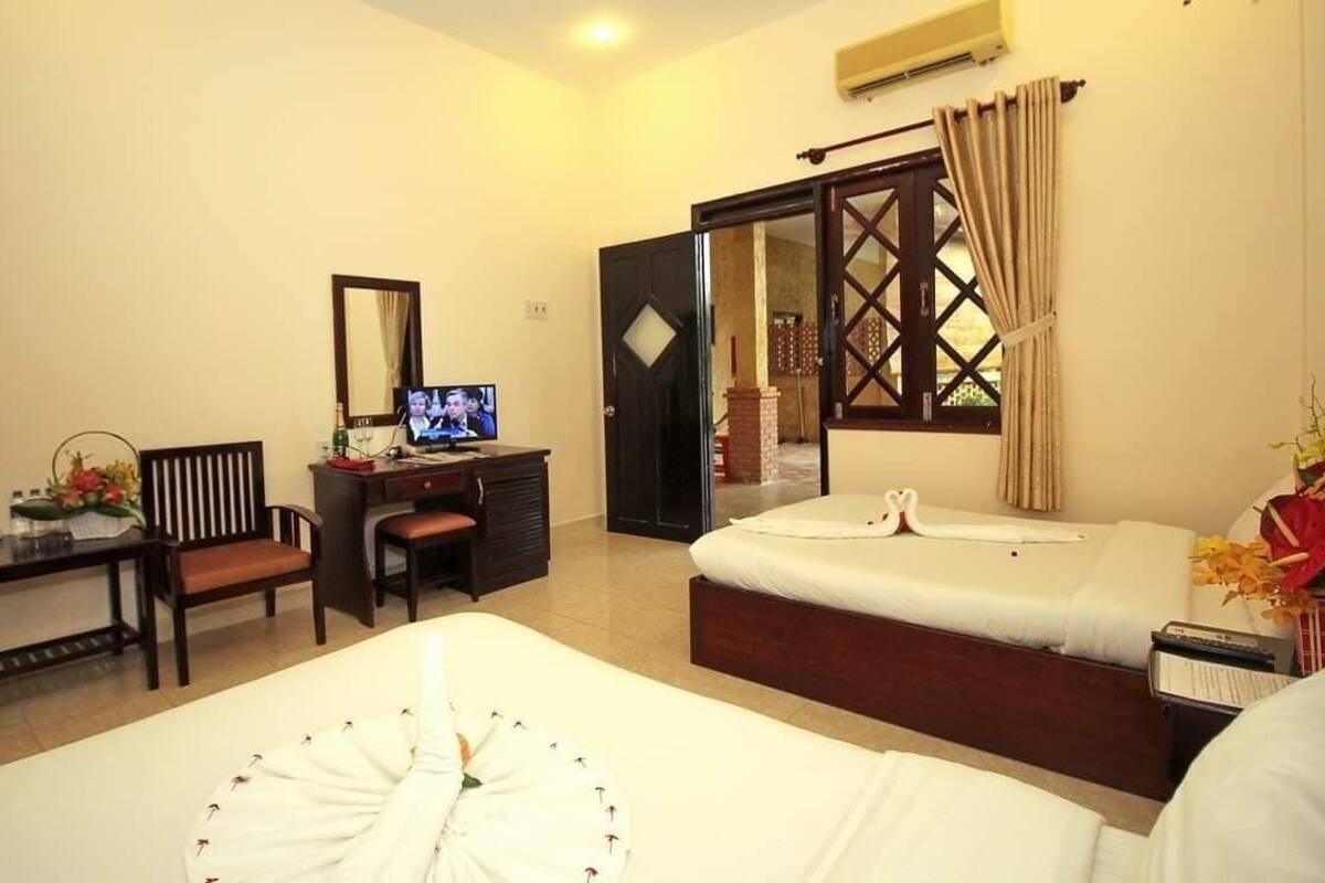 Superior Quadruple Room, Garden View | Minibar, blackout curtains, free WiFi