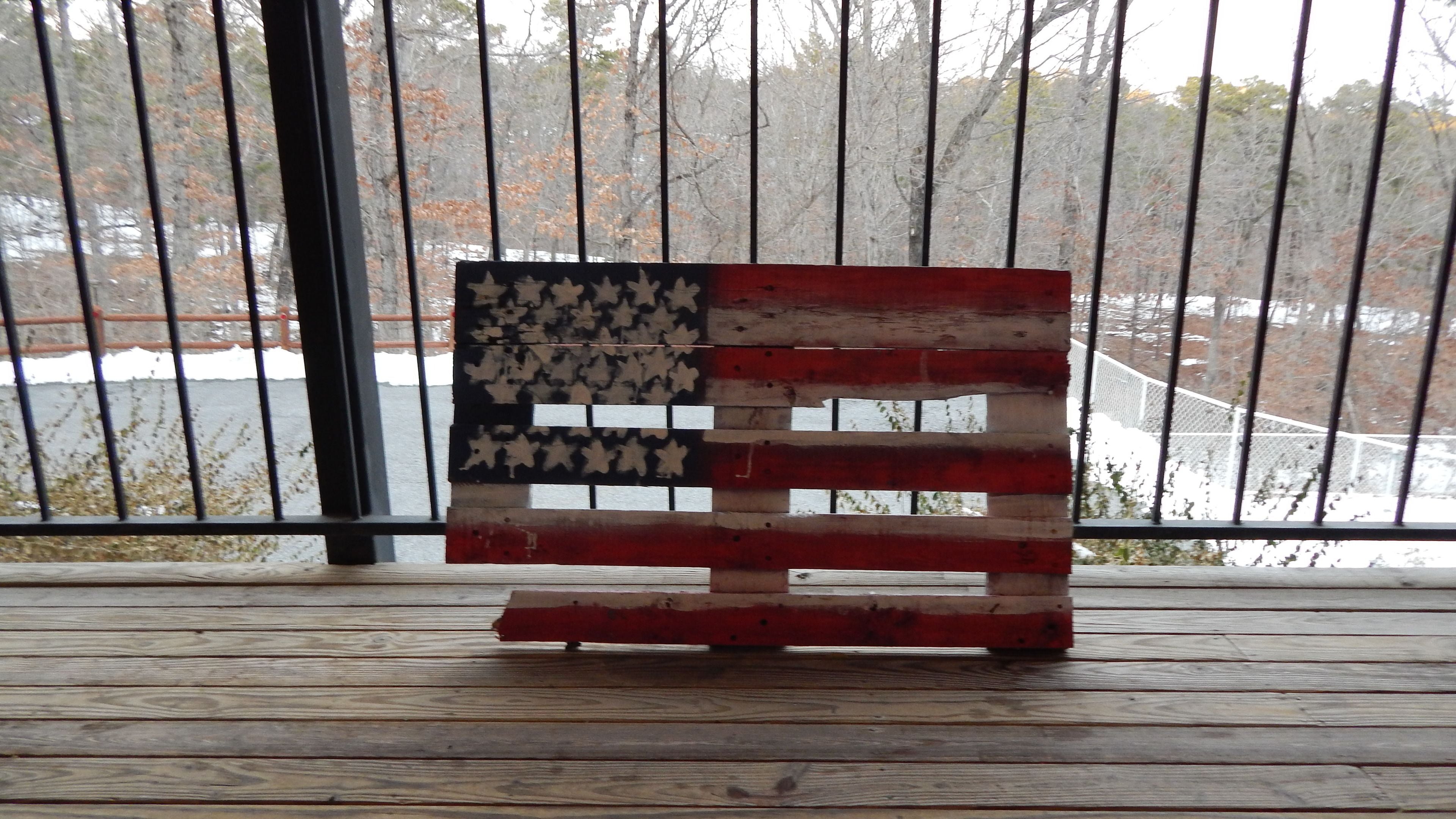A wooden bench with an American flag design.
