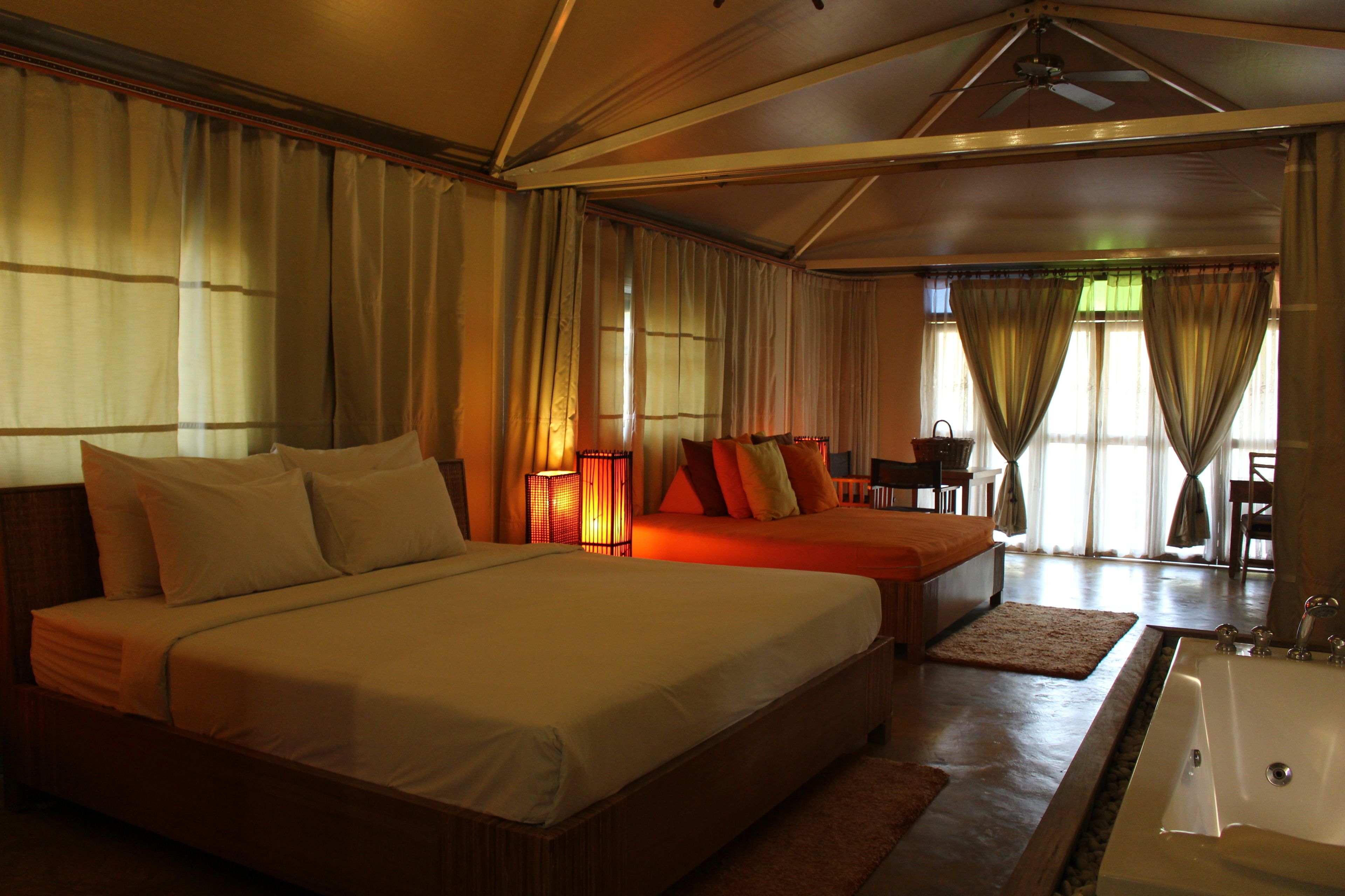 tent villa for 2 | premium bedding, minibar, desk, rollaway beds
