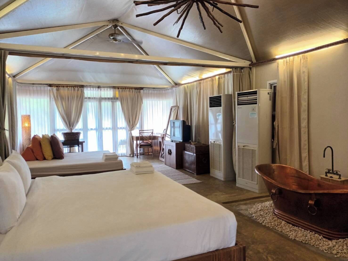 tent villa for 4 | premium bedding, minibar, desk, rollaway beds