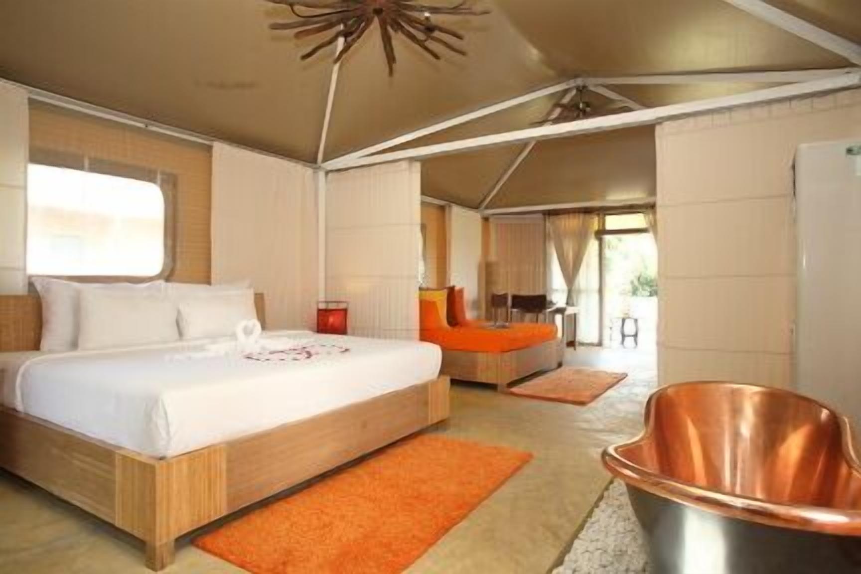 tent villa for 2 | premium bedding, minibar, desk, rollaway beds