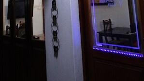 A reception sign with an arrow pointing right, a plaque with a 4.1 rating, and a window with a 2014 award for excellence. - Sleepers Villa (Polokwane)