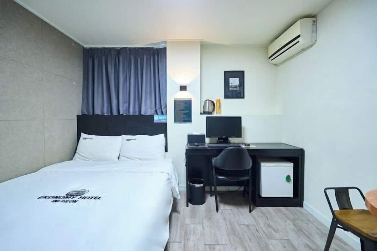 Premium bedding, desk, blackout drapes, iron/ironing board
