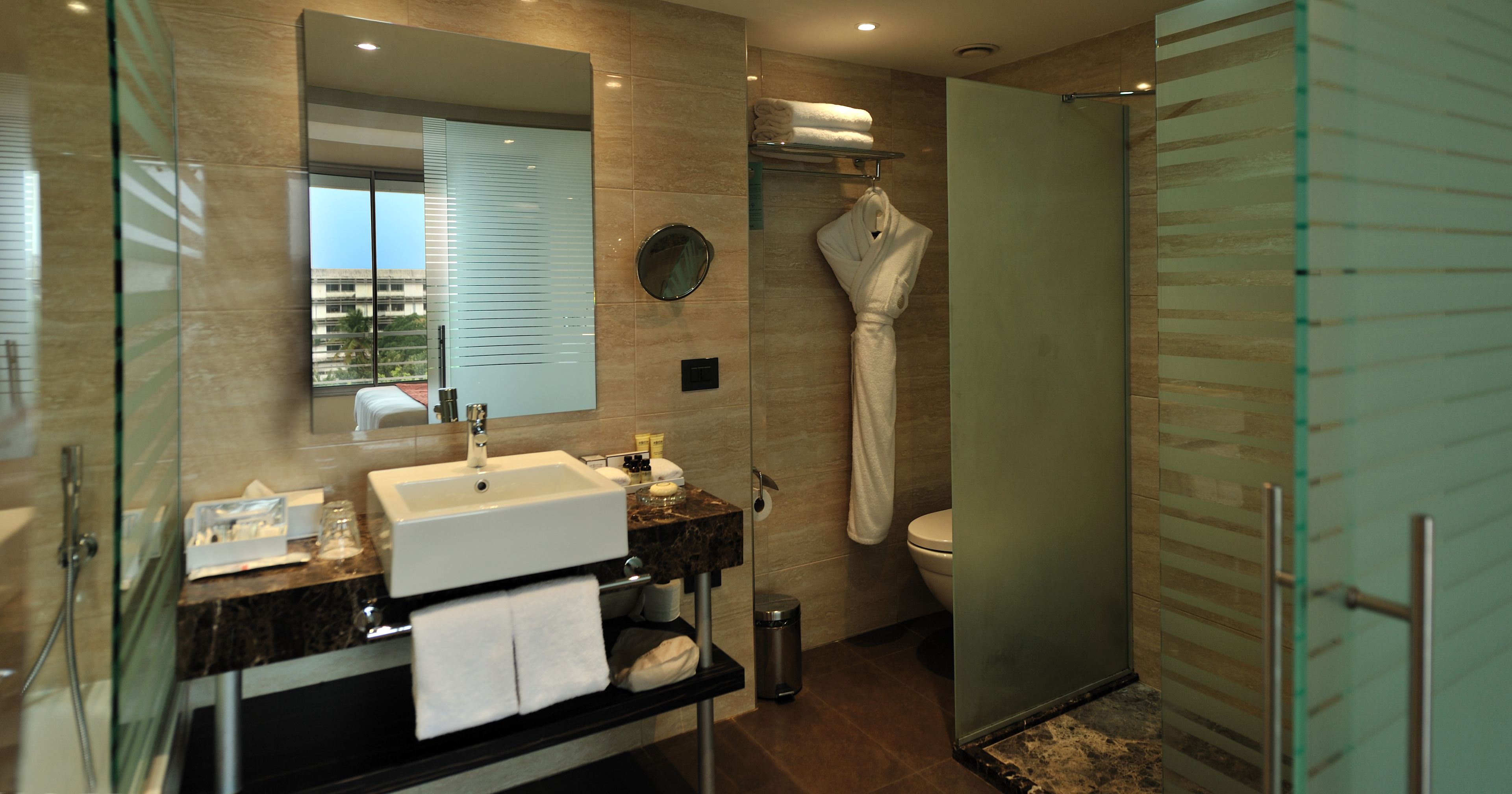 eco-friendly toiletries, hair dryer, bathrobes, slippers