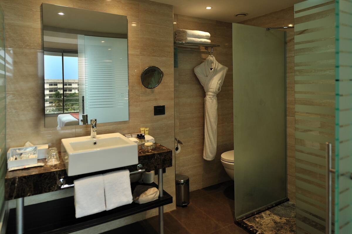 eco-friendly toiletries, hair dryer, bathrobes, slippers