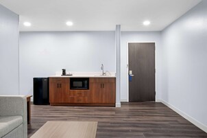 Suite, 1 King Bed, Non Smoking, Kitchenette (Shower Only;with Sofabed) | Private kitchenette | Mini-fridge, microwave, coffee/tea maker