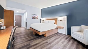 A modern hotel room with a wooden bed, a desk, and a chair. - Best Western Niantic - New London/Mystic Area (Niantic)