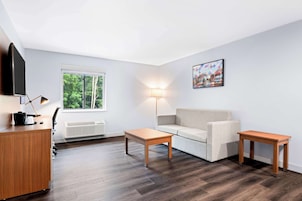 Desk, laptop workspace, iron/ironing board, free cribs/infant beds