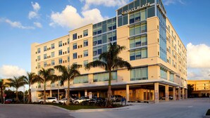 A multi-story hotel with a modern design, featuring a prominent "Hyatt Place" sign at the top.