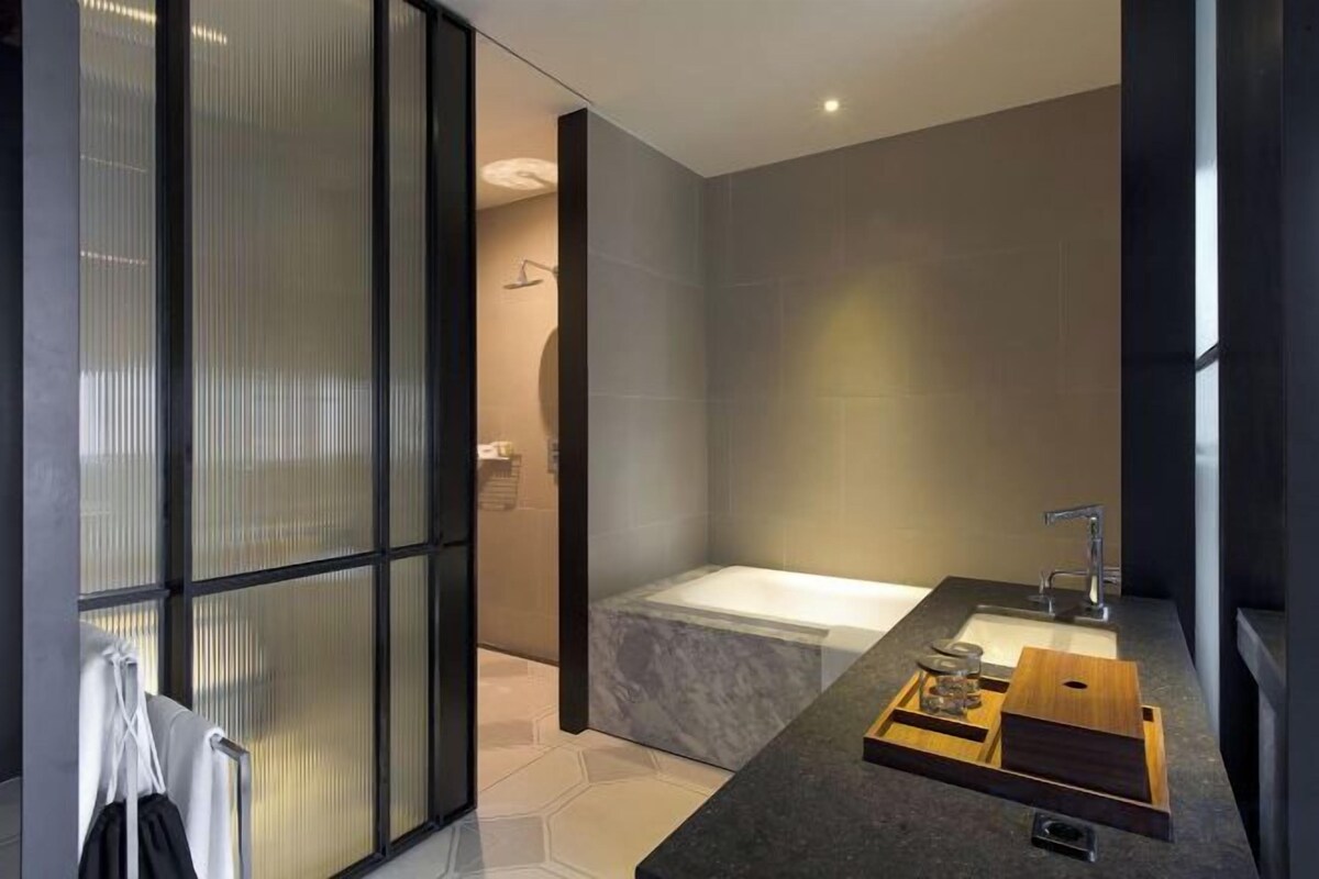 Bathroom | Rainfall showerhead, hair dryer, bathrobes, slippers