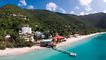 Enjoy beach access from our pier and take in the scenic views of the surrounding lush greenery.