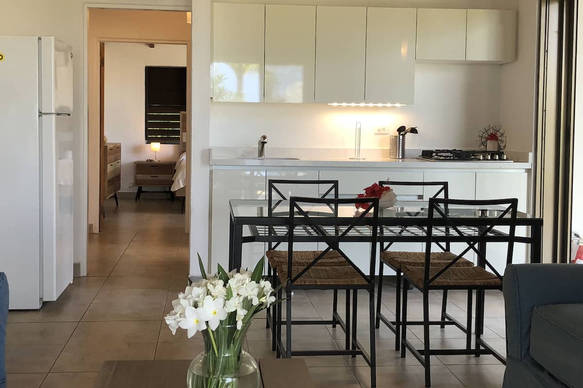 Deluxe Suite, 1 Bedroom, Patio, Garden View | Living area | 64-inch Smart TV with digital channels, TV